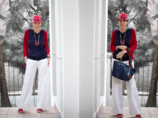 Navy blue top with red hat and white pants