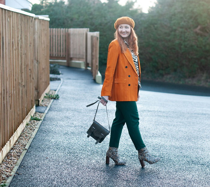 Catherine wearing orange blazer and trouser | 40plusstyle.com