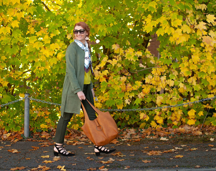 Catherine wearing jungle green coat and scarf | 40plusstyle.com