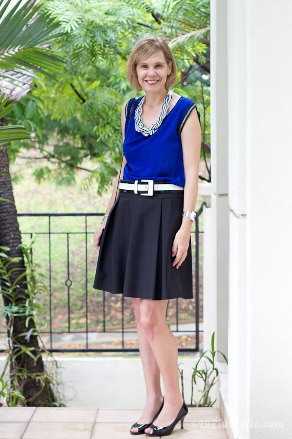 blue top black skirt