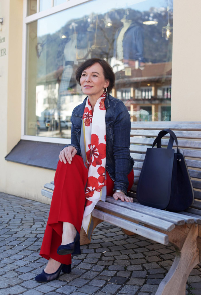 Annette Casual Wearing Denim Jacket with Scarf and Red Pants | 40plusstyle.com