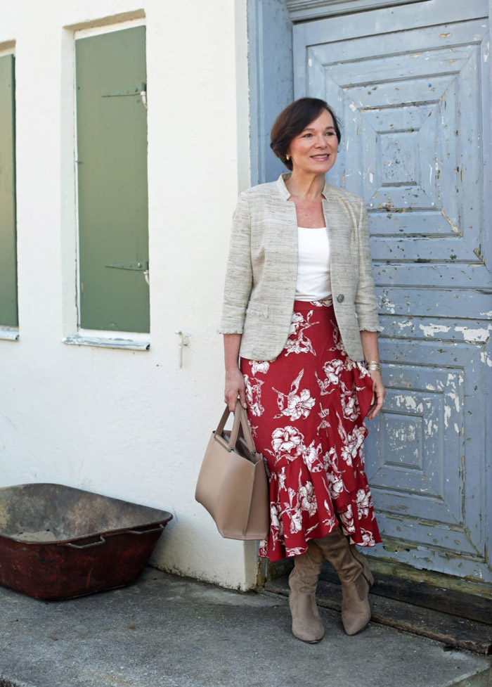 Annette Wearing Cream Blazer and Red Floral Skirt | 40plusstyle.com