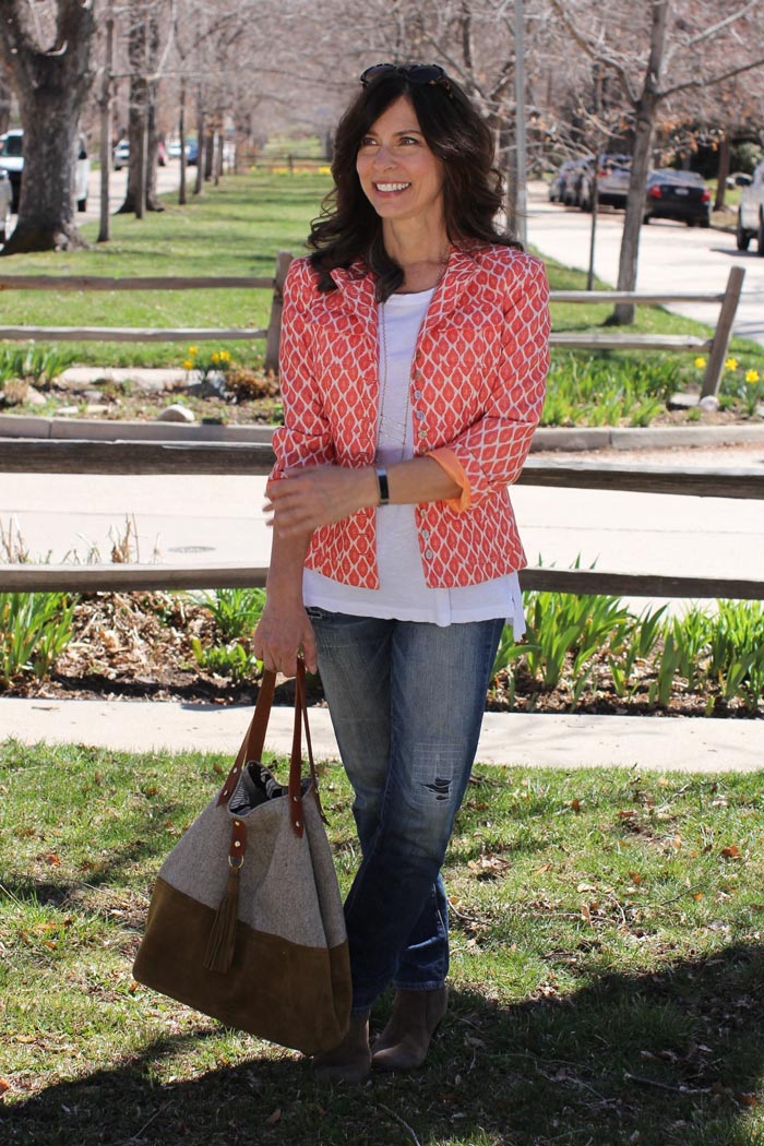 Ana wearing a orange printed blazer over white top and jeans | 40plusstyle.com