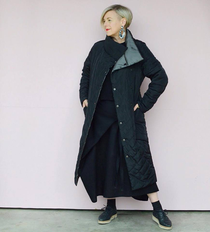 Deborah wearing black long coat | 40plusstyle.com