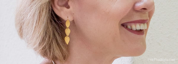 Closeup of J S Noor golden earrings | 40plusstyle.com