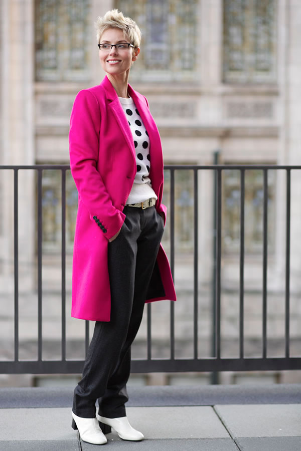 Colorful fuchsia man coat on black and white outfit | 40plusstyle.com