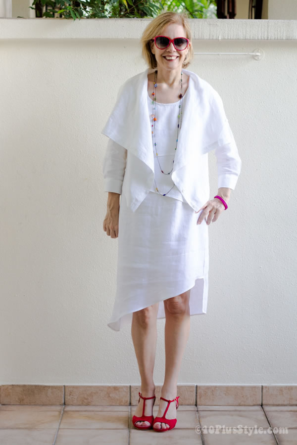 Dressed in white with colorful beaded necklace | 40plusstyle.com