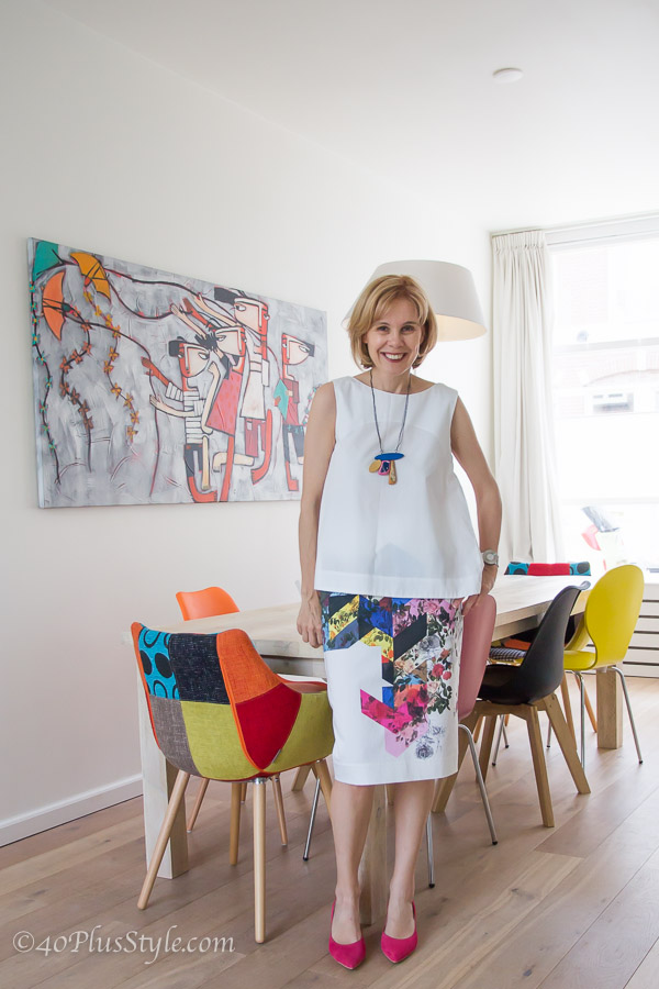 preen colorful flower skirt in a house full of color