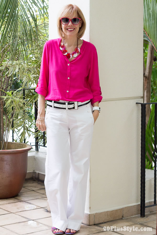 wearing bellbuttoned white pants with fuchsia top | 40plusstyle.com