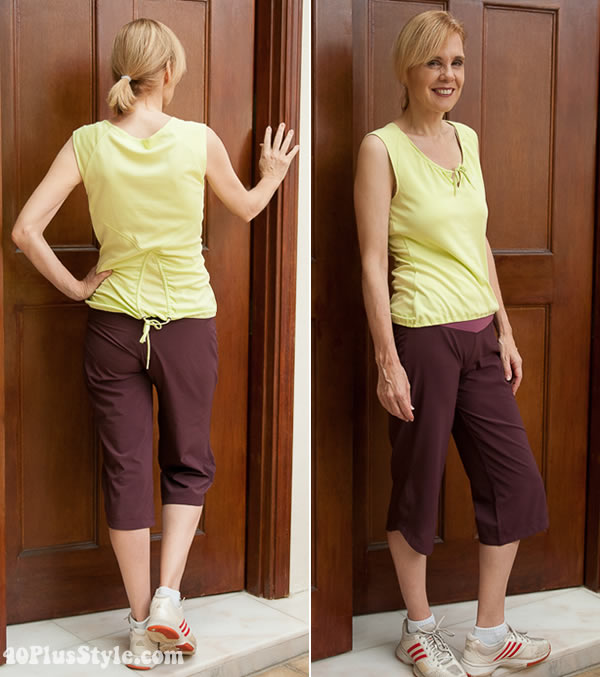 Fitness clothes for women - Sylvia wears a yellow top and purple pants | 40plusstyle.com
