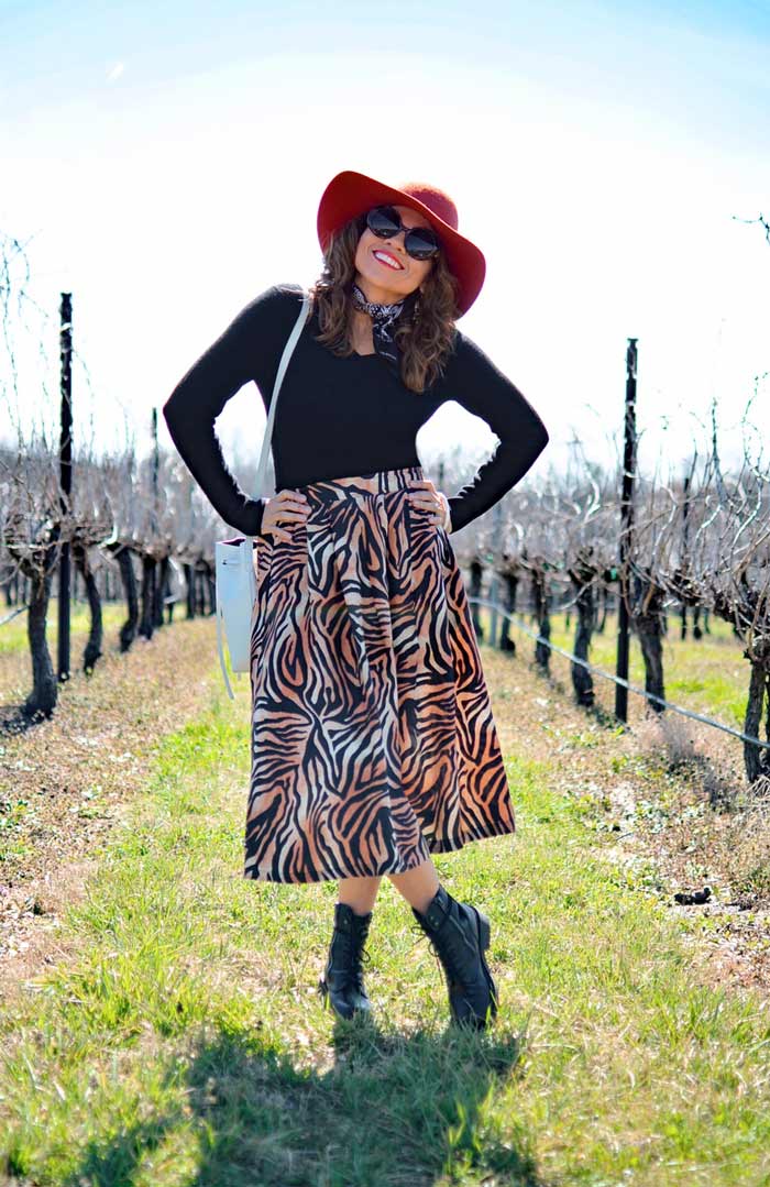 Carelia wearing leopard print skirt and combat boots | 40plusstyle.com