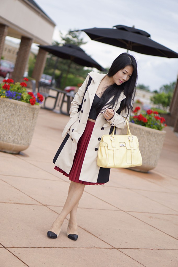 Red pleated skirt and trench coat outfit | 40plusstyle.com