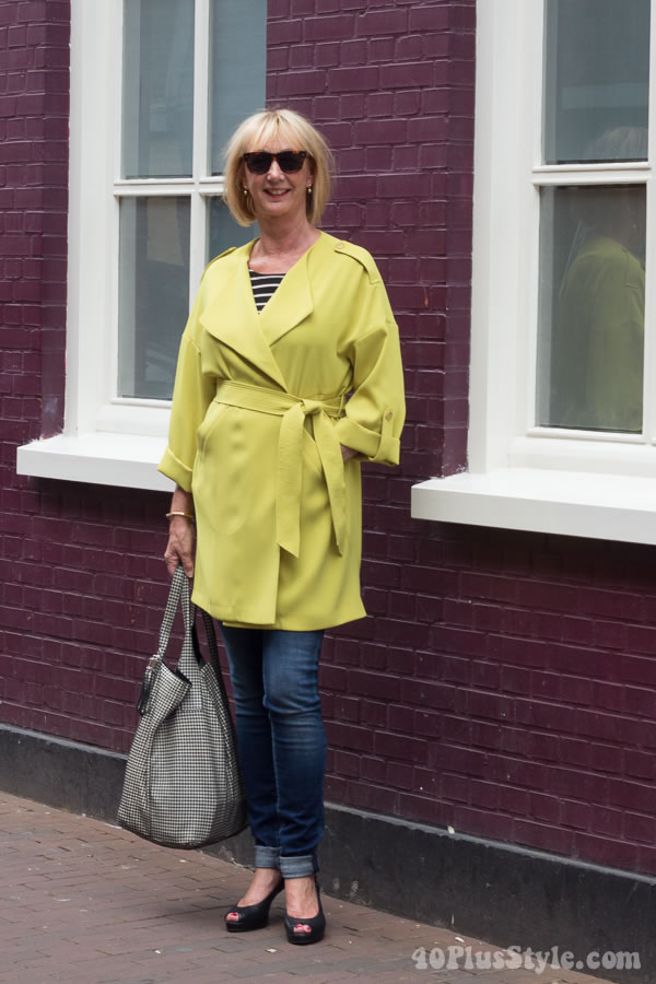 Travel diary outfits: Greetje's chic green coat and denim skinnies | 40plusstyle.com
