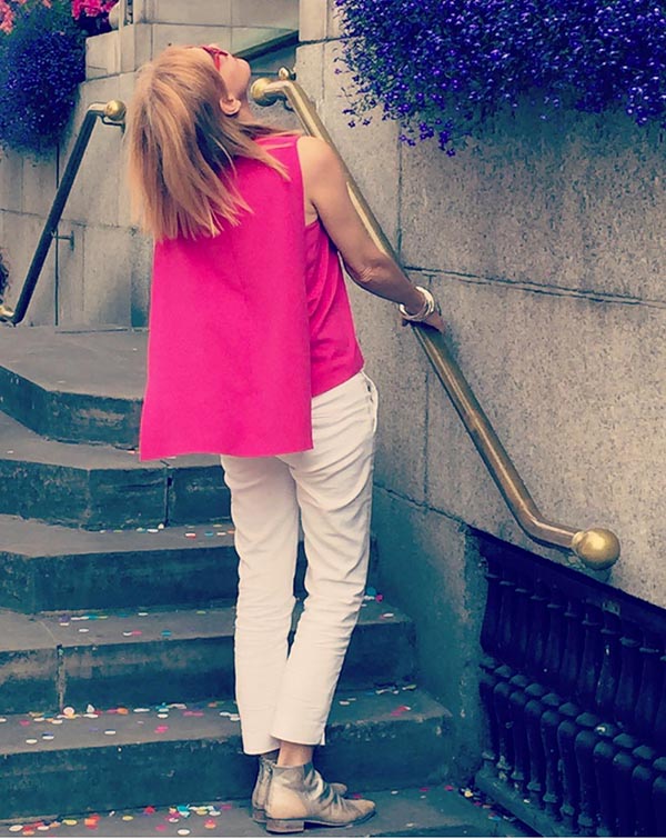 Style idea: Pink capelet top with skinny 7/8 pants | 40plusstyle.com