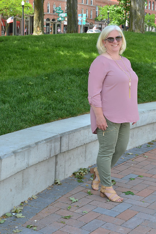 Julia wearing rose pink top with green pants | 40plusstyle.com