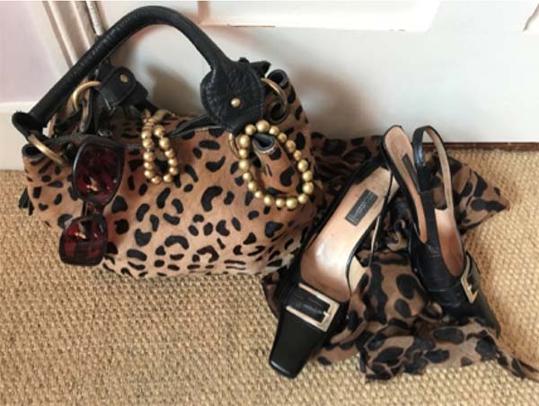 Match animal print accessories with a black heels for an edgier look | 40plusstyle.com