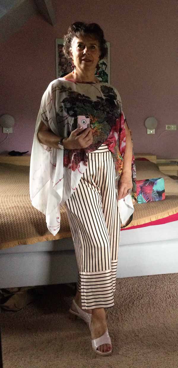 Pinstriped pants paired with chic florals | 40plusstyle.com