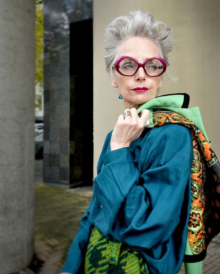 Melanie wearing a blue blouse and chic glasses | 40plusstyle.com