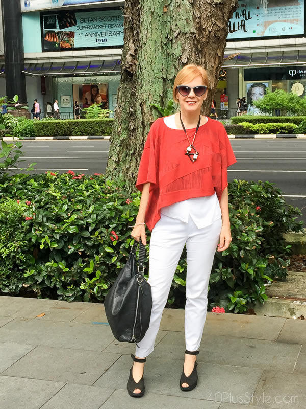 Red cropped top over white base - How to do more with less | 40plusstyle.com