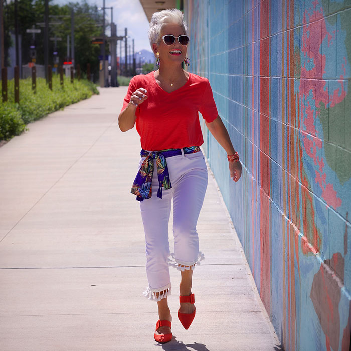 Shauna wearing red tee and white jeans | 40plusstyle.com