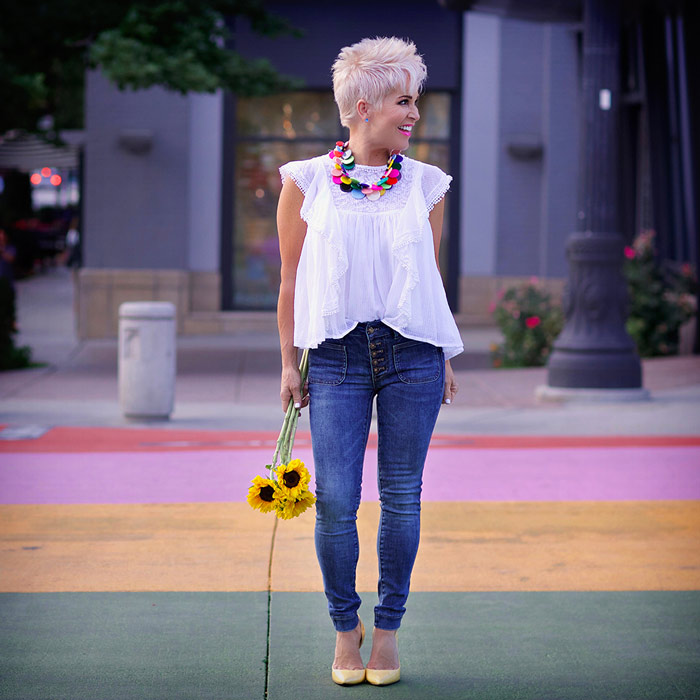 Shauna wearing white flounce top and jeans | 40plusstyle.com