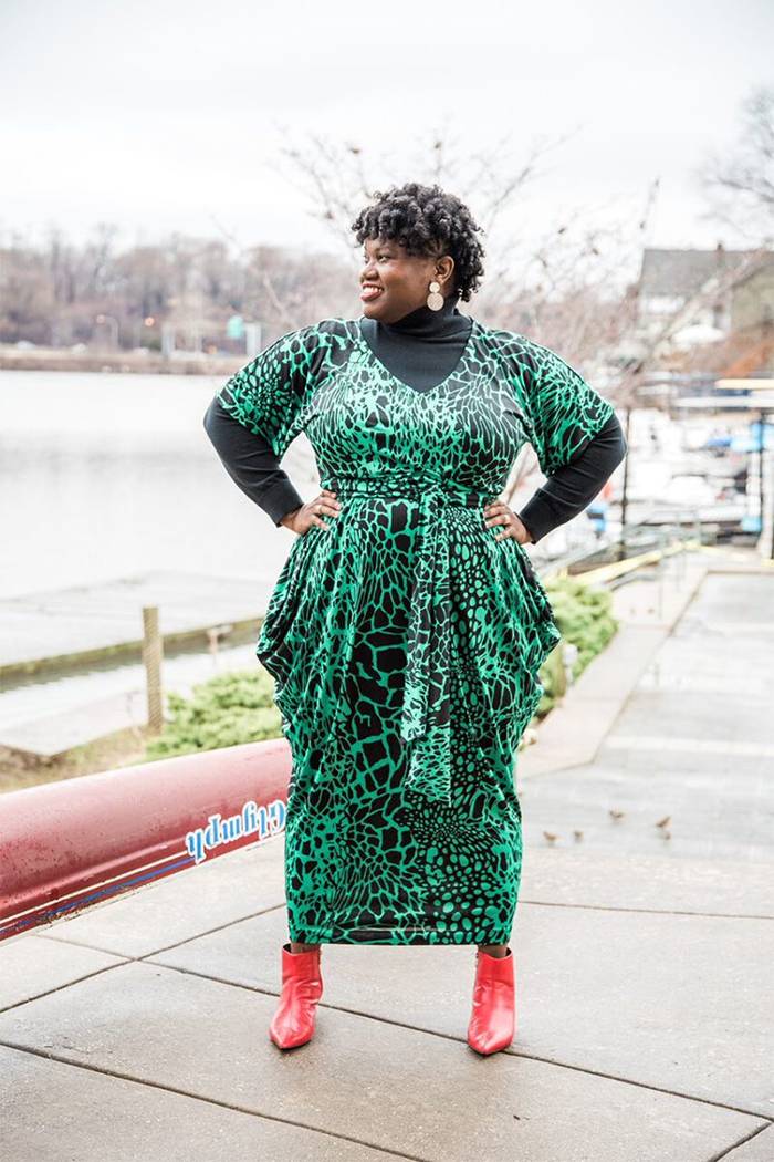 Georgette from Grown and Curvy Women is wearing Black Turtleneck Sweatshirt over Green Animal Print Dress and Red Bootie | fashion over 40 | 40plusstyle