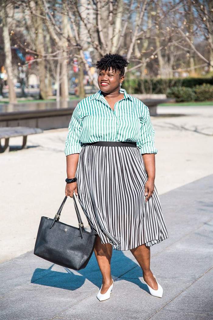 Georgette from Grown and Curvy Women is wearing Green Stripe Blouse and Pleated Skirt and Black Tote | fashion over 40 | 40plusstyle