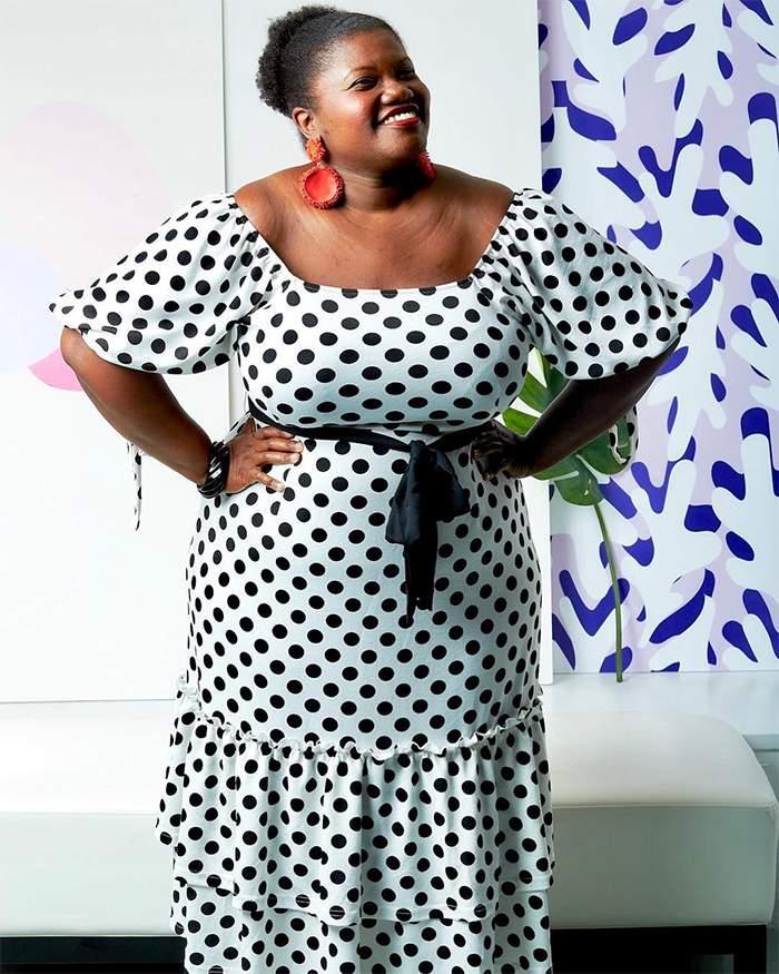 Georgette from Grown and Curvy Women is wearing Polka Dot Wrap Dress with Red Earrings | fashion over 40 | 40plusstyle