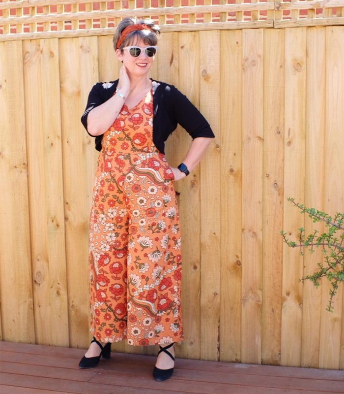 wearing an orange printed jumpsuit | 40plusstyle.com