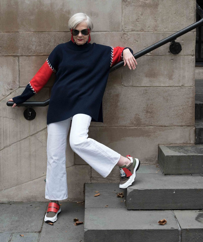 Accidenatal Icon Wearing Navy and Red Sweater | 40plusstyle.com