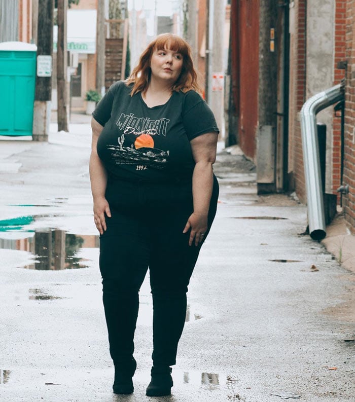 Ann wearing a graphic tee with jeans and boots | 40plusstyle.com