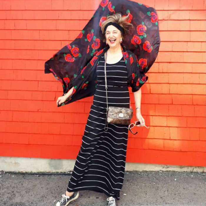 Terri wearing a striped maxi dress and floral cardigan | 40plusstyle.com