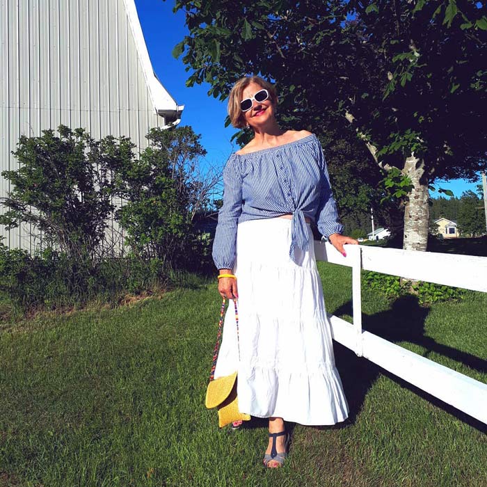 Terrie wearing an off shoulder blouse and maxi skirt | 40plusstyle.com