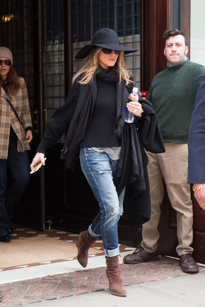 Jennifer Aniston fall look - sweater, floppy har, scarf, ripped jeans and booties | 40plusstyle.com