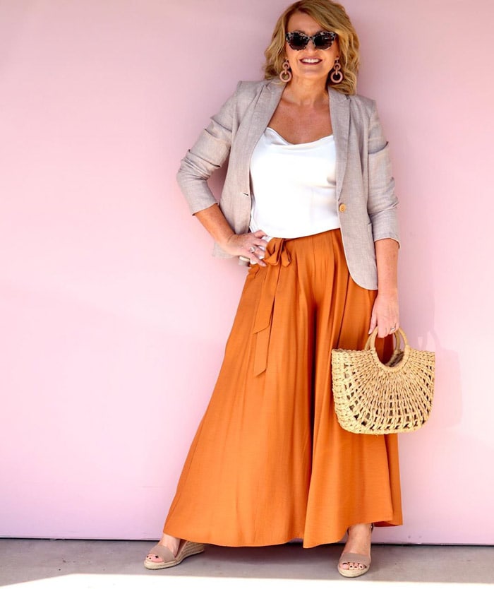 wear an orange skirt with a beige jacket | 40plusstyle.com