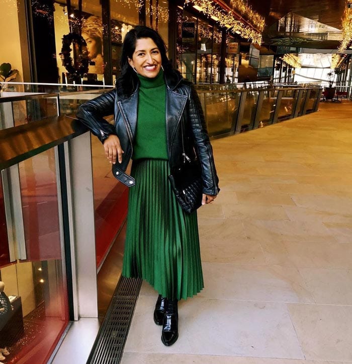 green pleated skirt and moto jacket | 40plusstyle.com