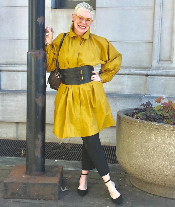 wearing a yellow shirt dress belted over pants | 40plusstyle.com