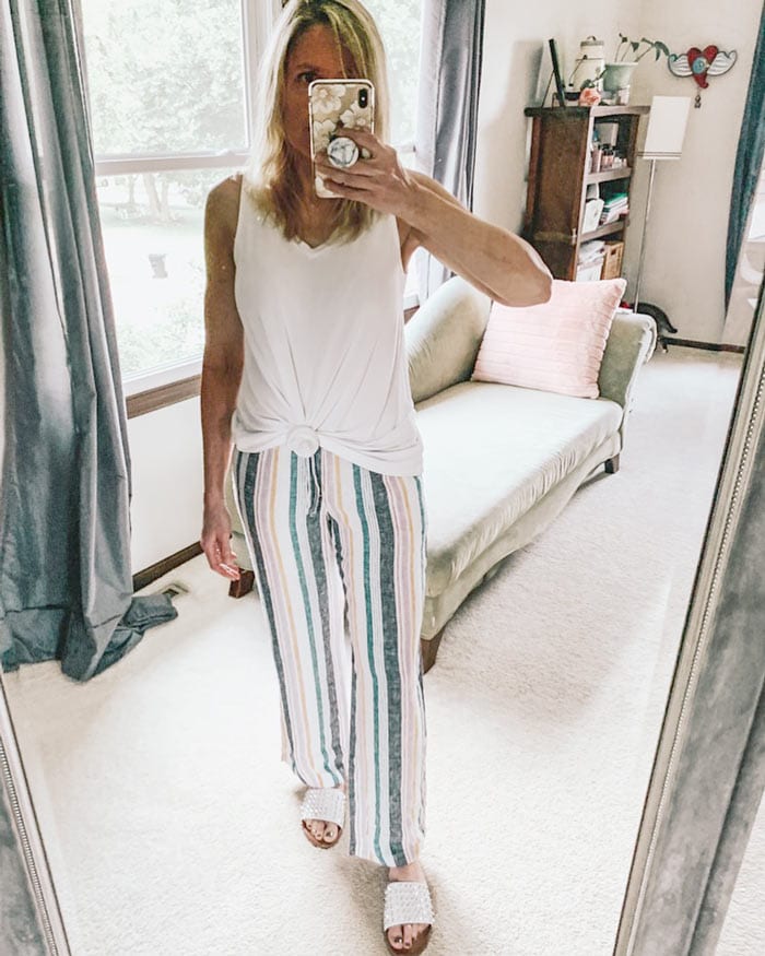 loungewear outfit featuring striped drawstring pants and a knotted tank | 40plusstyle.com