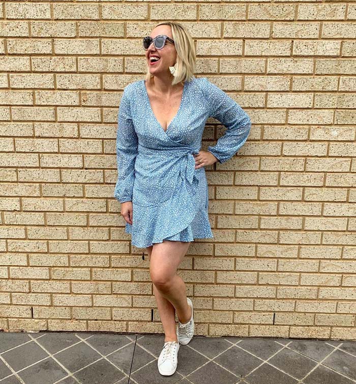 wearing a mini wrap dress with sneakers | 40plusstyle.com