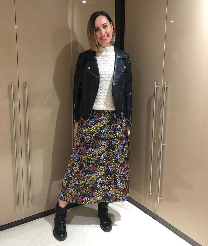 Lou wearing biker boots and a floral skirt | 40plusstyle.com