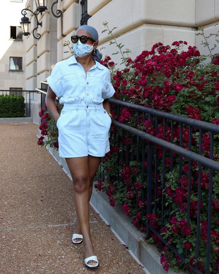 Psyche wears flat mules with her romper suit | 40plusstyle.com