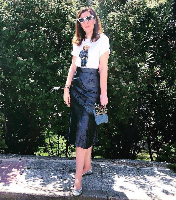 Rocio wearing silver ballet flats and a black skirt | 40plusstyle.com