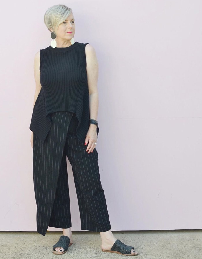 Deborah wearing an asymmetrical top and pants | 40plusstyle.com