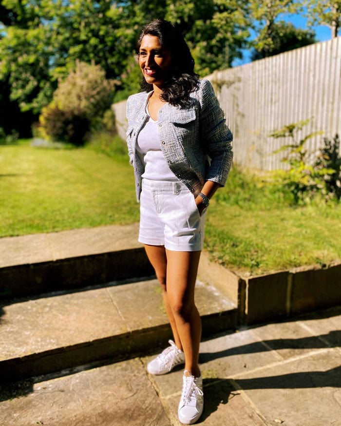 Monika wearing a white t-shirt, shorts and blazer | 40plusstyle.com