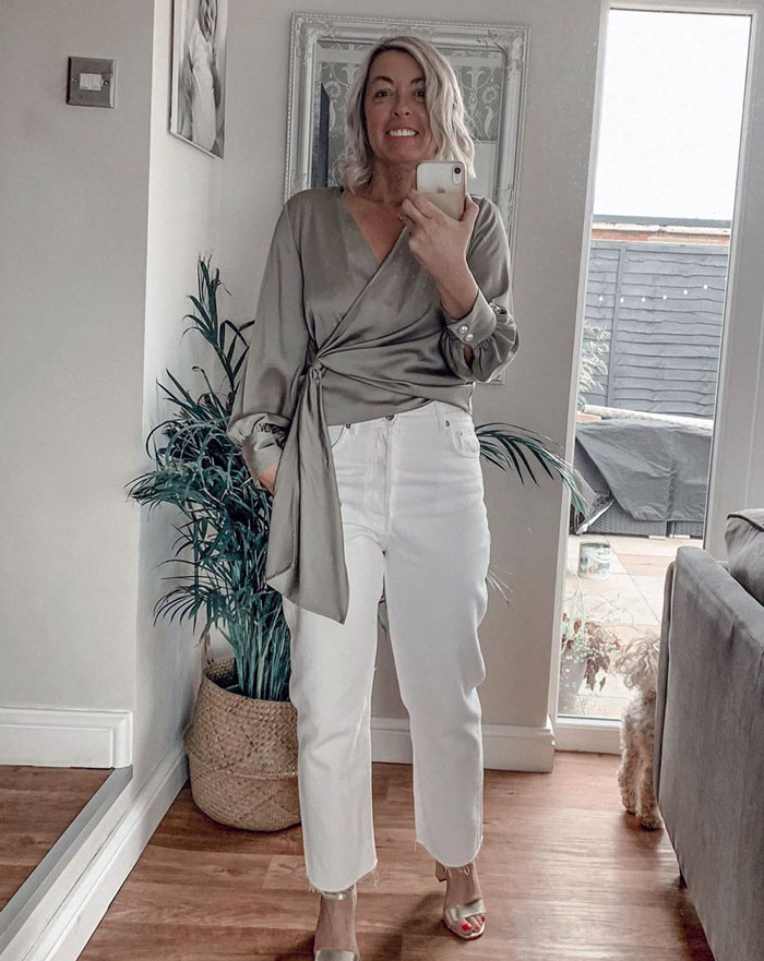 Sarah wears a wrap top and white jeans | 40plusstyle.com