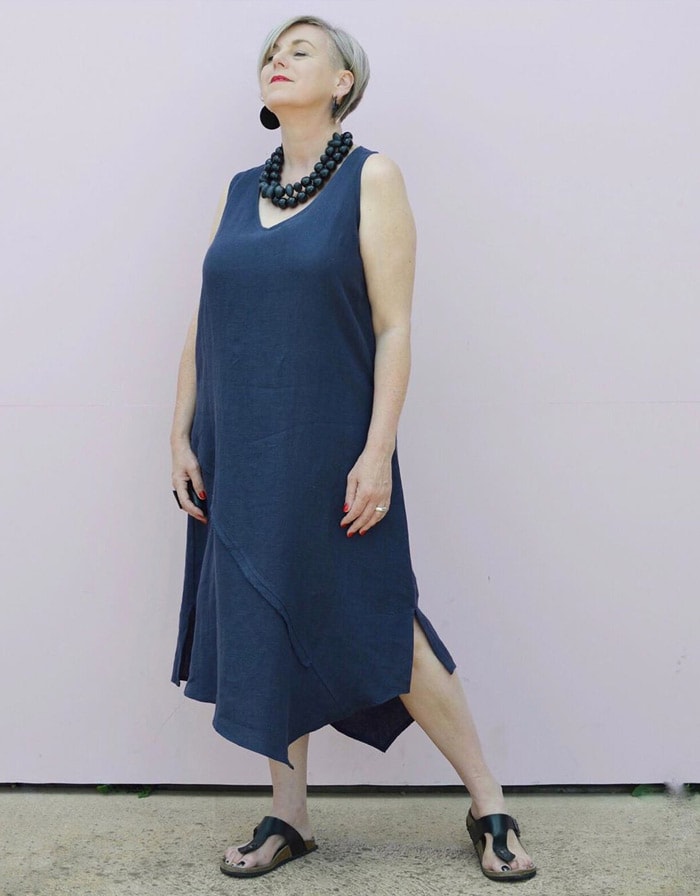 Deborah wears a navy dress with black accessories | 40plusstyle.com