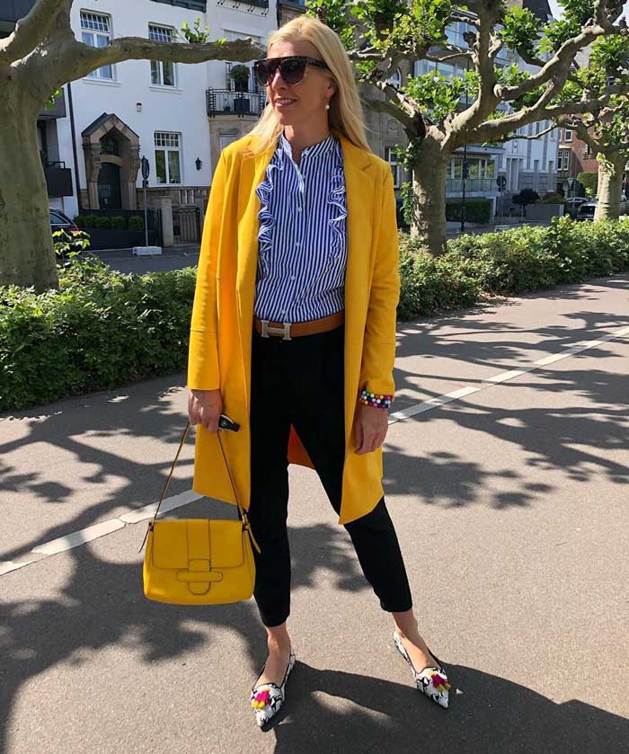 best coats for winter - Nadine in a yellow coat | 40plusstyle.com