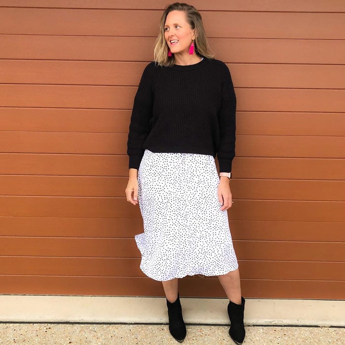 Nic wears a summer skirt with a sweater | 40plusstyle.com