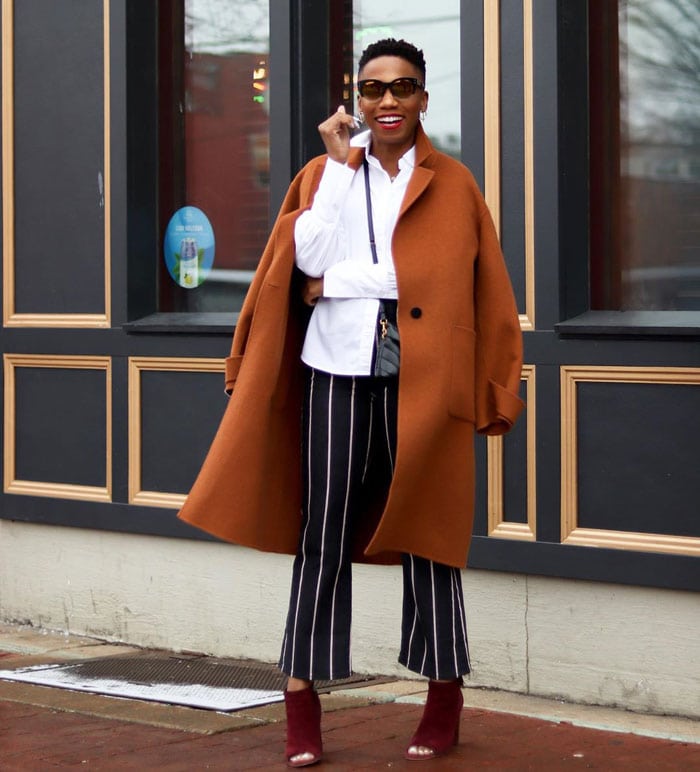 Psyche wears an orange coat and burgundy boots for fall | 40plusstyle.com