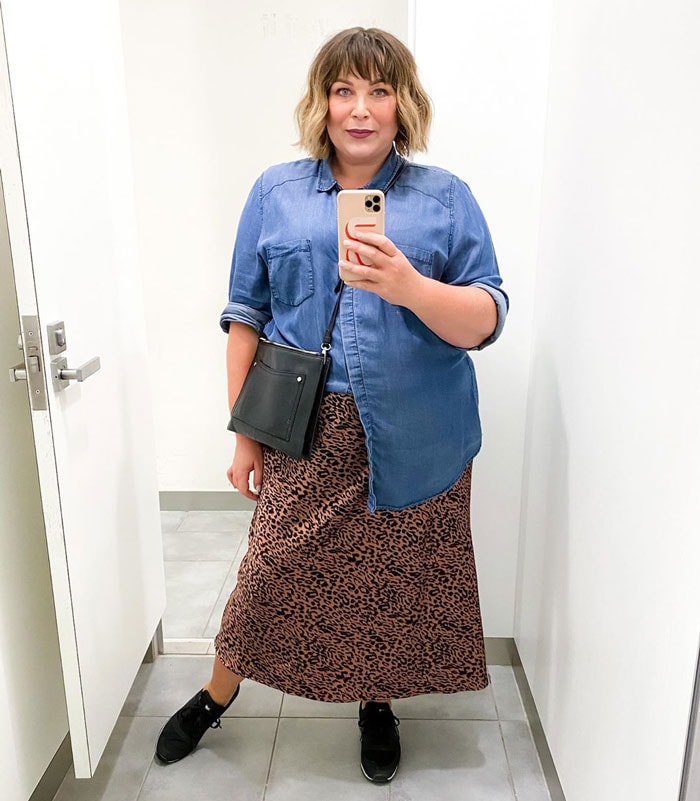 Sara wears a denim shirt and leopard print skirt | 40plusstyle.com